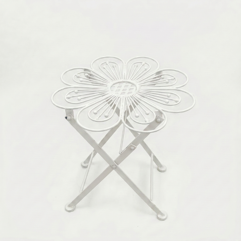 Metal flower bistro table in white on white background