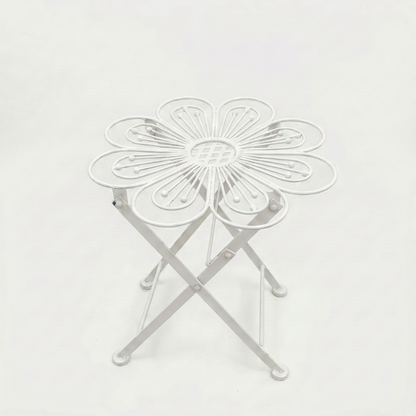 Metal flower bistro table in white on white background