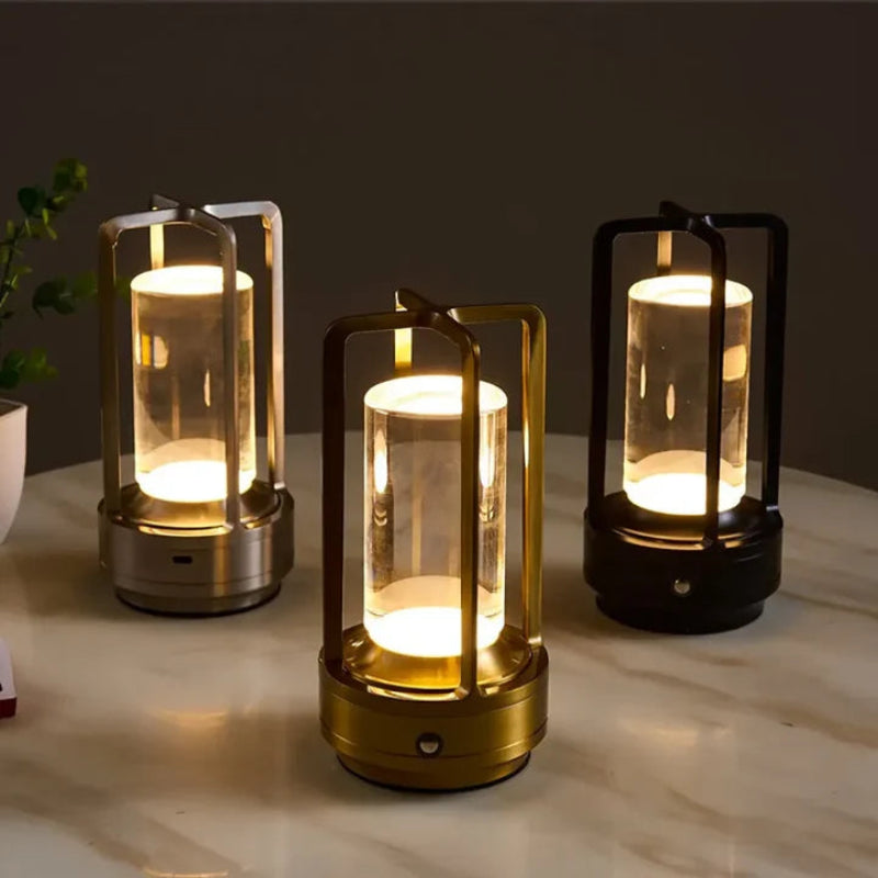 Silver, black and gold table lamps decorated on a table.