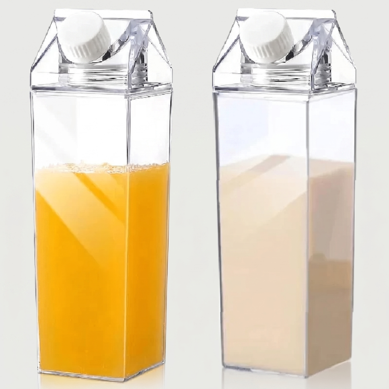 Milk carton style water bottles filled with orange juice and milk on white background