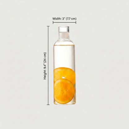 Clear bottle with sliced oranges inside, shown with measurements on a light gray background