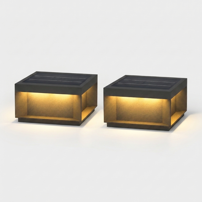 Set of two modern black LED solar outdoor deck lights on white background