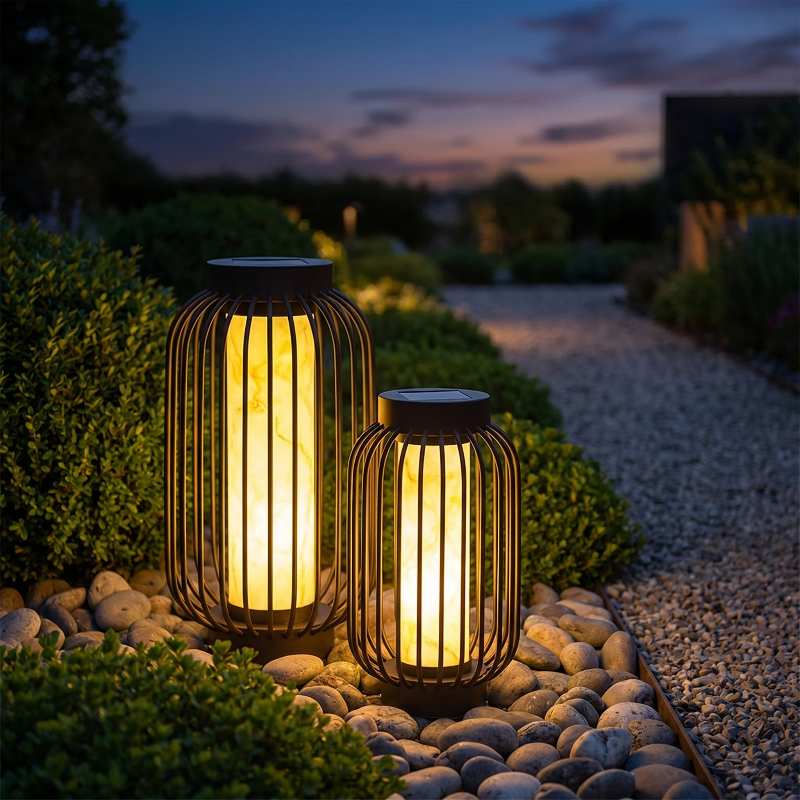 Modern outdoor solar lanterns glowing along a garden path at dusk