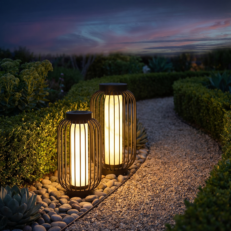 Modern outdoor solar lantern glowing along a garden path at twilight
