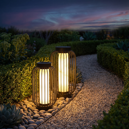 Modern outdoor solar lantern glowing along a garden path at twilight