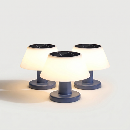 Set of four modern portable solar table lamps on white background