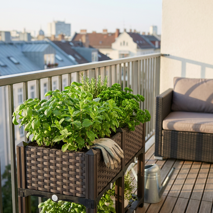 Modular raised garden planter bed on balcony with leafy green plants