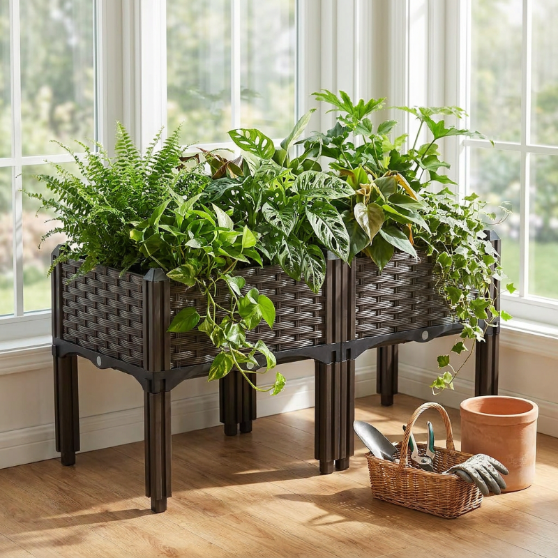 Modular raised garden planter beds on patio with herbs and potted plants