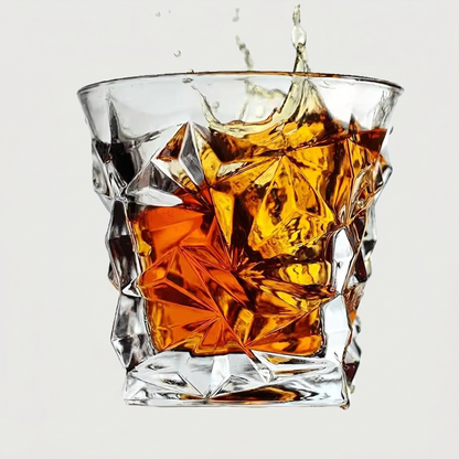 Glass of whiskey with ice cubes on a white background