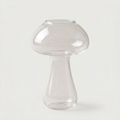 Clear mushroom cocktail glass on white background
