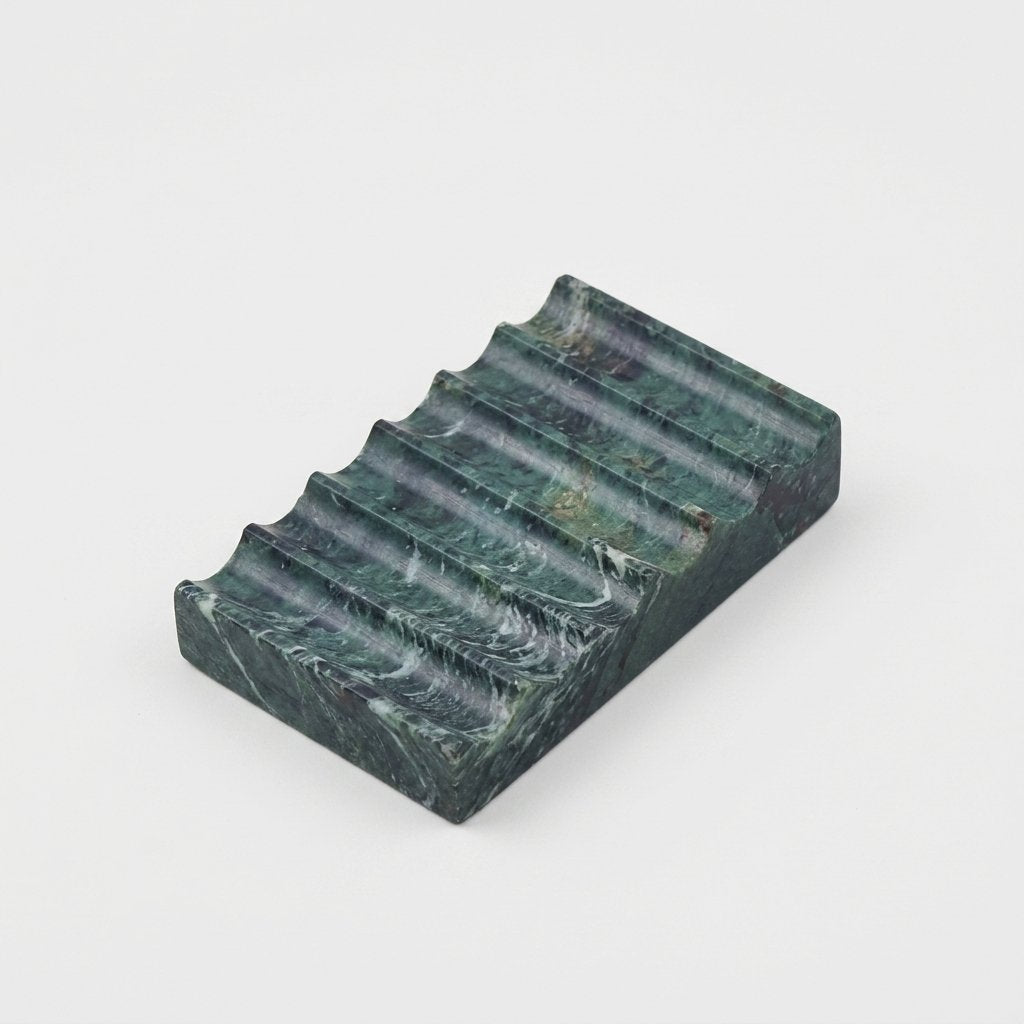 Green marble Natural Marble Soap Dish with white swirled veining, ridged draining grooves, hero shot on a clean off-white background