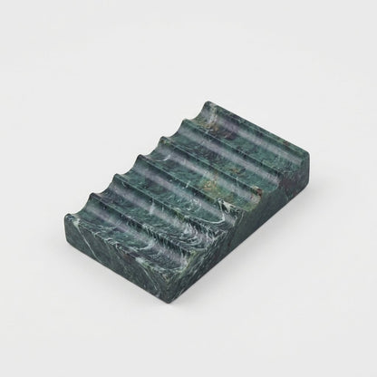 Green marble Natural Marble Soap Dish with white swirled veining, ridged draining grooves, hero shot on a clean off-white background