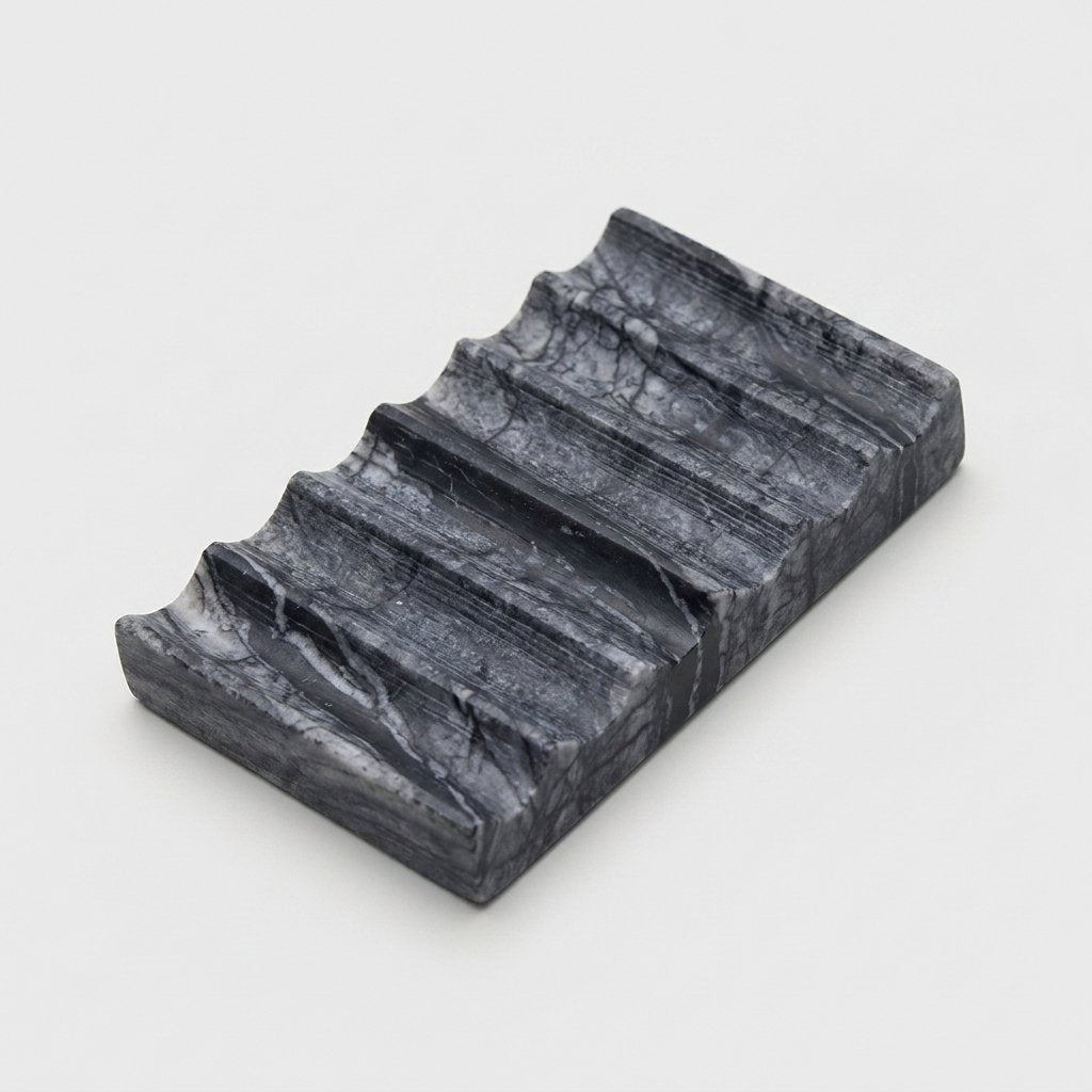 Grey marble Natural Marble Soap Dish with dark veining, ridged draining grooves, hero shot on a clean off-white background