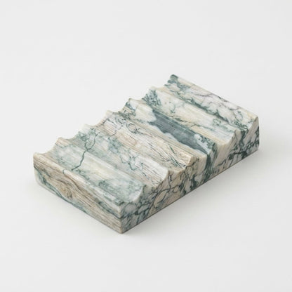 White marble Natural Marble Soap Dish with subtle grey veining, ridged draining grooves, hero shot on a clean off-white background