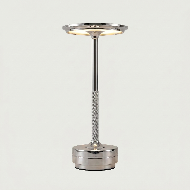Silver lamp with a cylindrical design on a light gray background