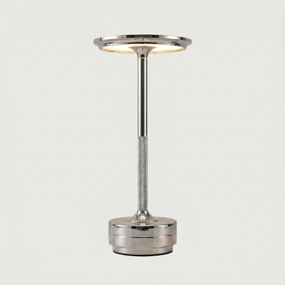 Silver lamp with a cylindrical design on a light gray background