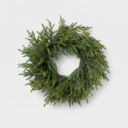 24-inch Norfolk pine wreath with lush lifelike green needles on a clean off-white background