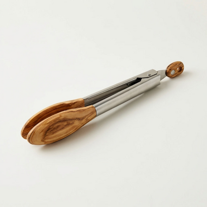 Stainless steel and wood tongs on white background with wood detail