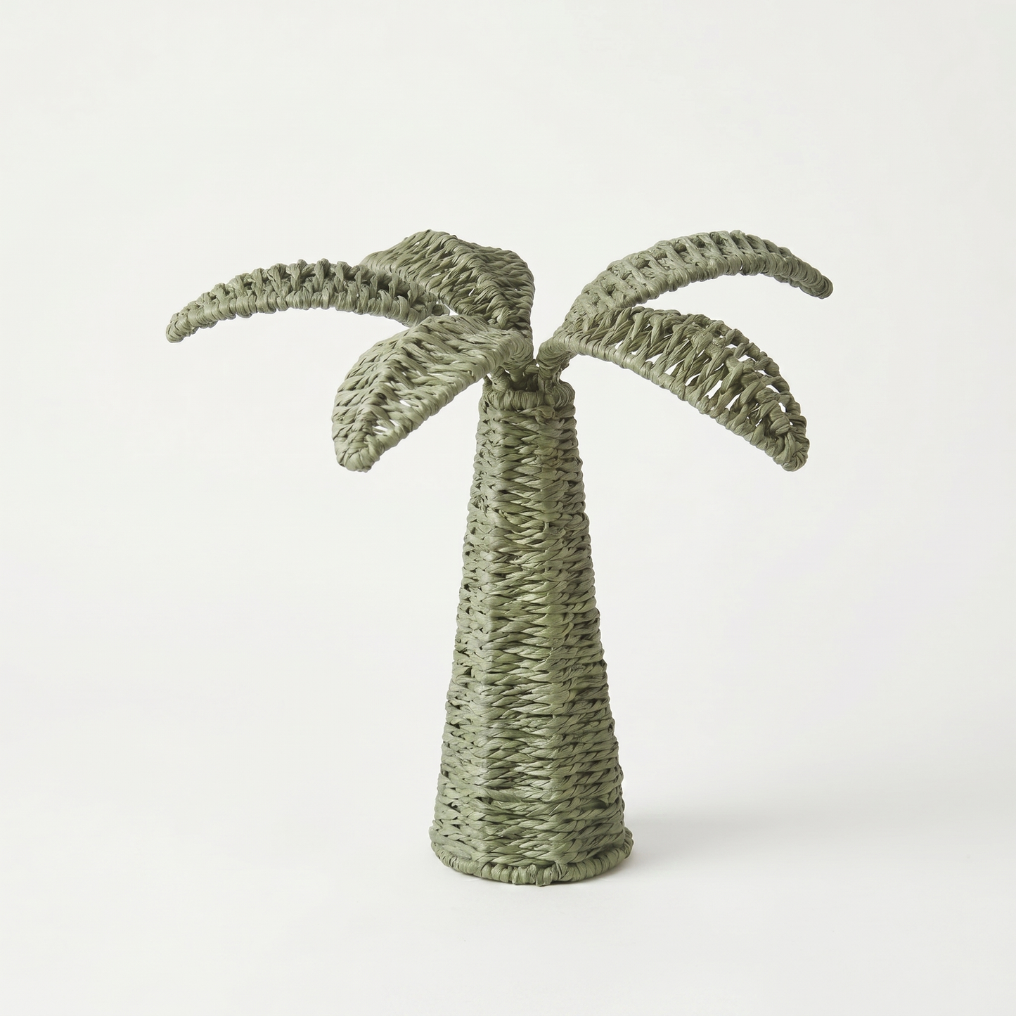 Woven palm tree decoration on a white background