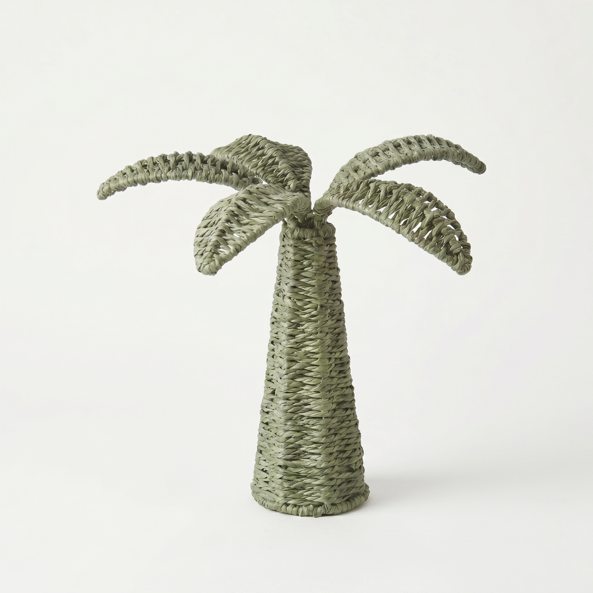 Woven palm tree decoration on a white background