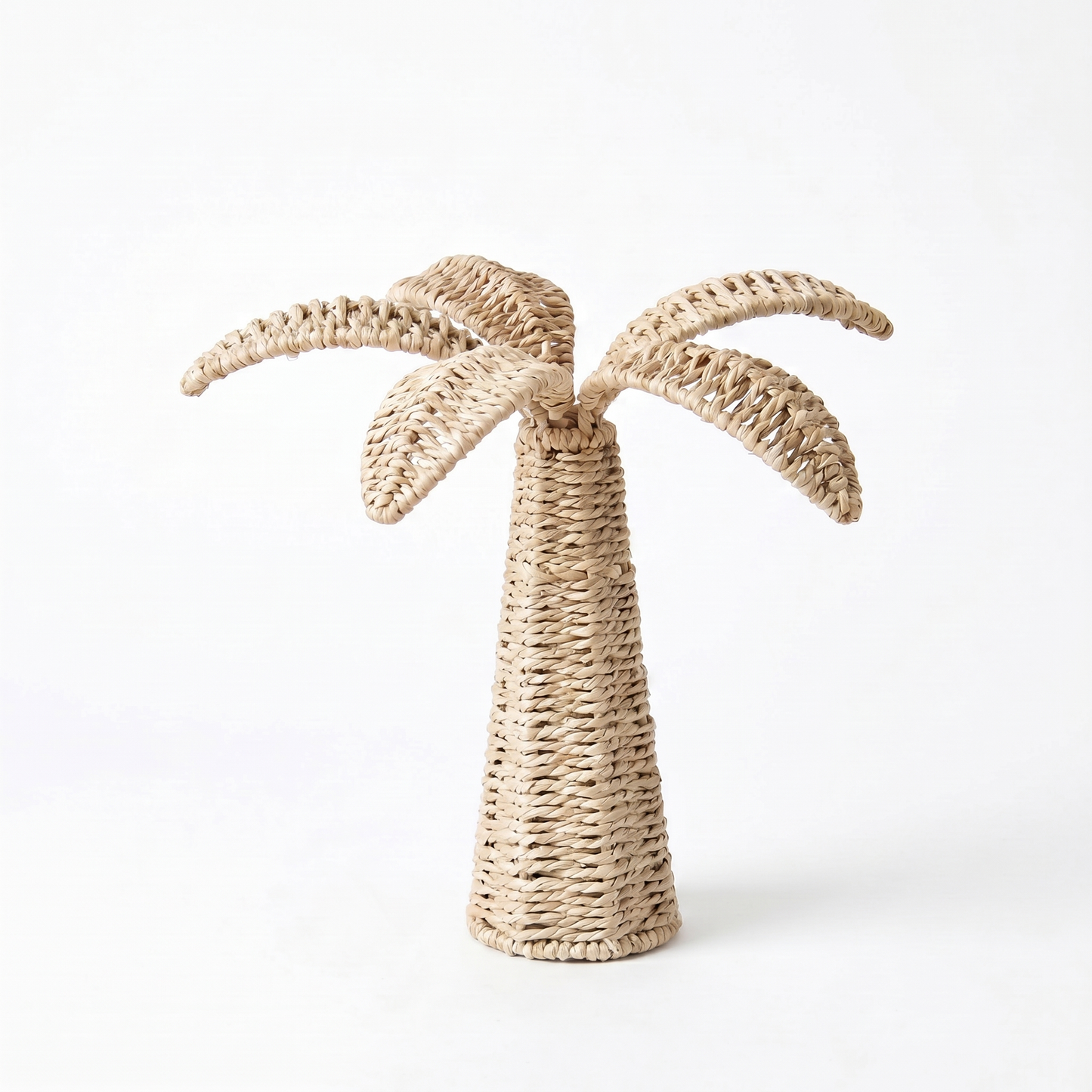 Woven palm tree decoration on a white background