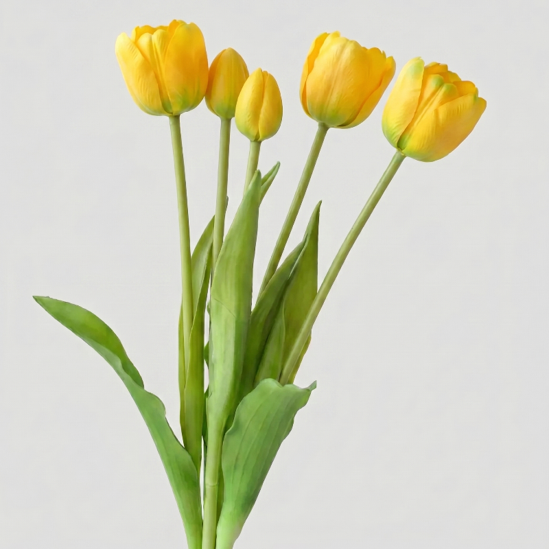 Golden yellow parrot faux silicone tulips on white background