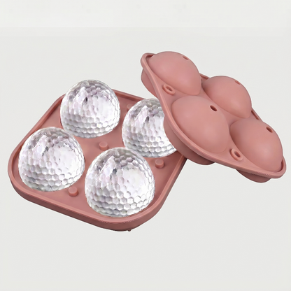 Pink golf ball ice mold tray on white background