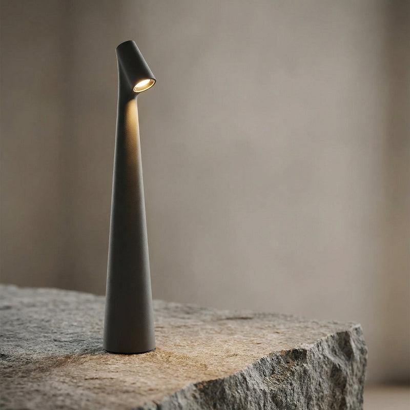 Modern indoor lamp on a stone surface with a neutral background