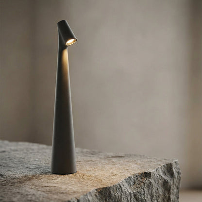 Modern indoor lamp on a stone surface with a neutral background