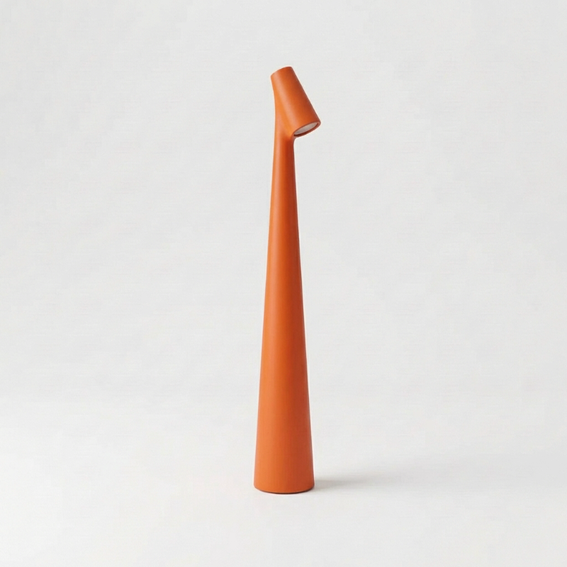 Orange portable LED table lamp with minimalist cordless design