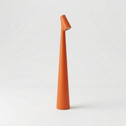 Orange portable LED table lamp with minimalist cordless design
