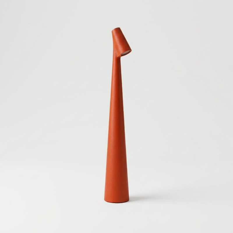 Red portable LED table lamp with sleek minimalist silhouette