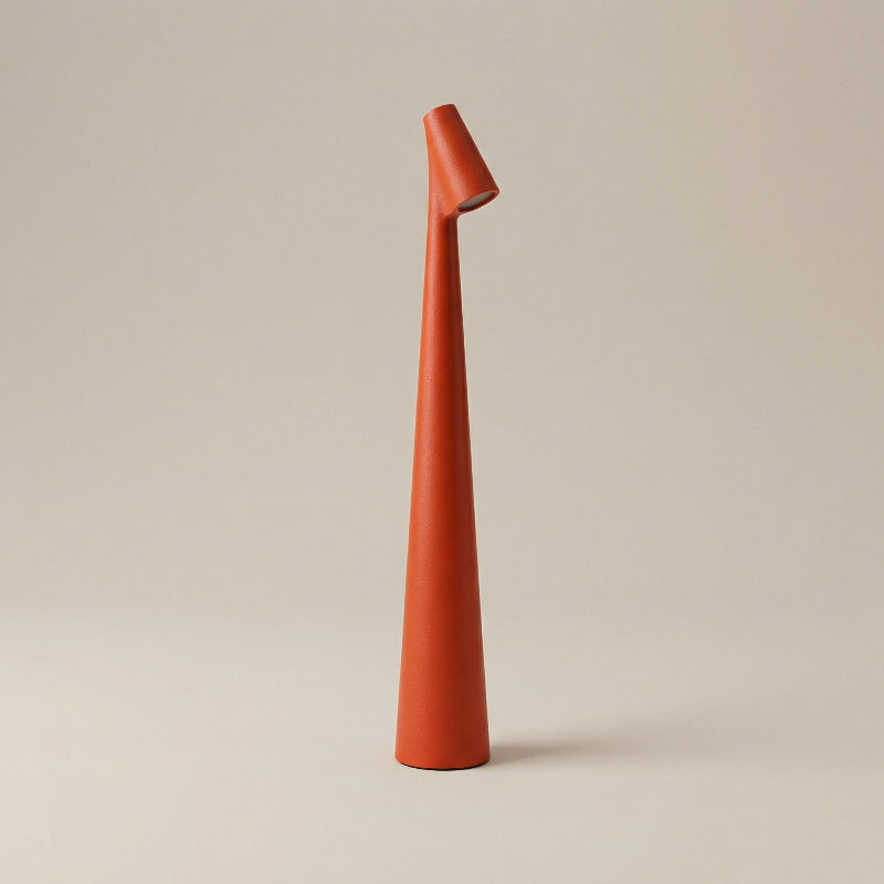 Tall, orange ceramic vase on a beige background