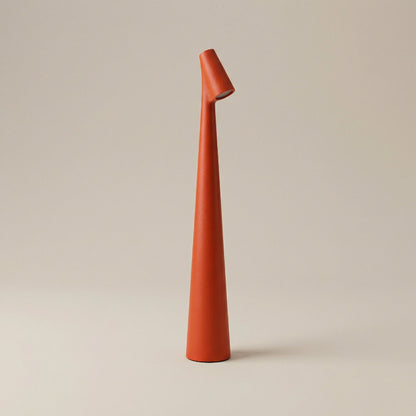 Tall, orange ceramic vase on a beige background