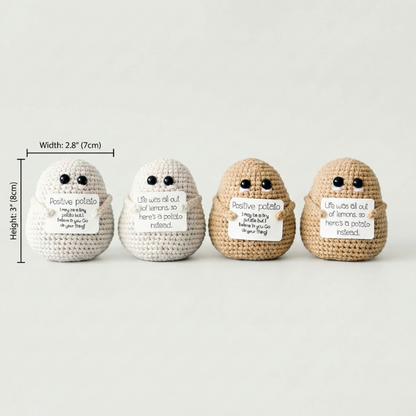 Set of positive potato crochet dolls in different colors on white background