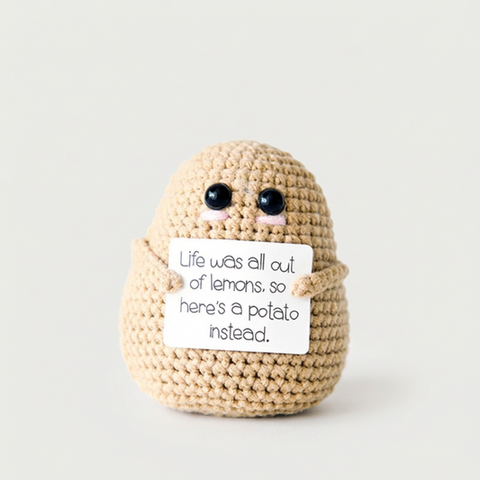 Beige positive potato crochet doll on white background