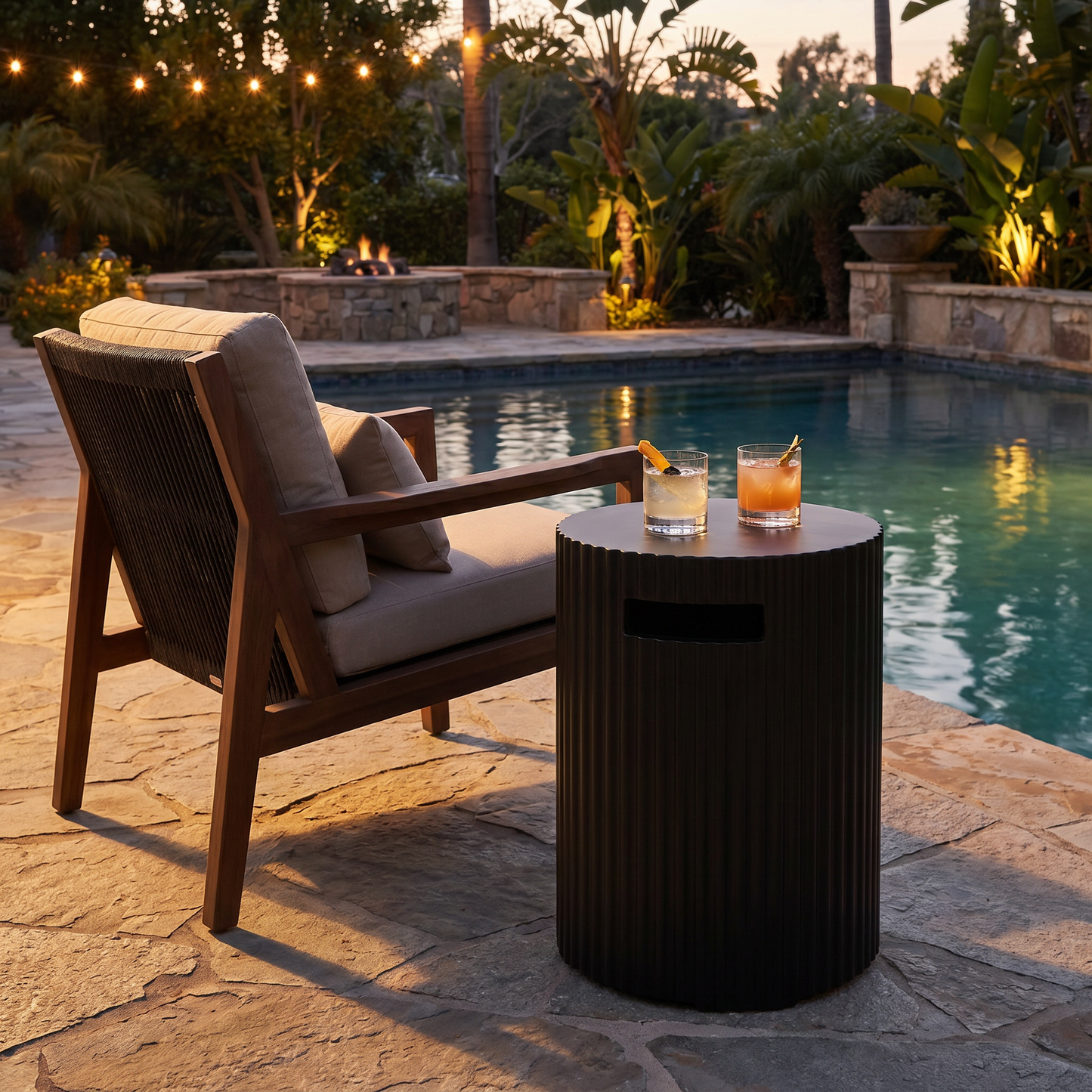 Black Outdoor Propane Tank Holder styled in a poolside setting, concealing a propane tank
