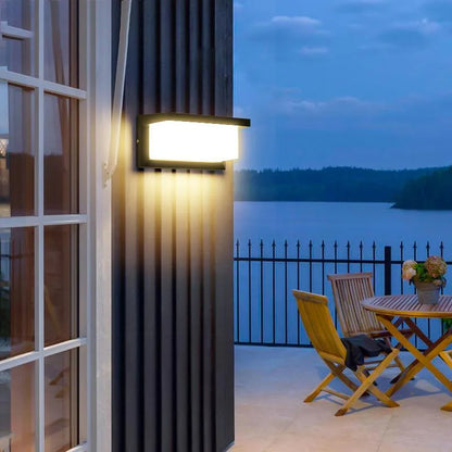 The Arya 1 Motion Sensor Light in an outdoor setting. Perfect for balconies or patios, this weather-resistant light enhances security with its automatic on/off function.