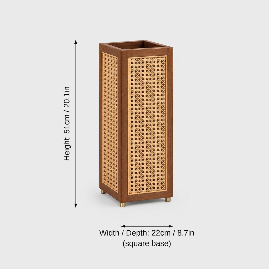 Square rattan cane umbrella stand with a dark wood frame and brass feet on a light grey background with dimensions labeled Height 51 cm or 20.1 in and Width and Depth 22 cm or 8.7 in