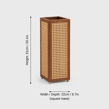 Square rattan cane umbrella stand with a dark wood frame and brass feet on a light grey background with dimensions labeled Height 51 cm or 20.1 in and Width and Depth 22 cm or 8.7 in