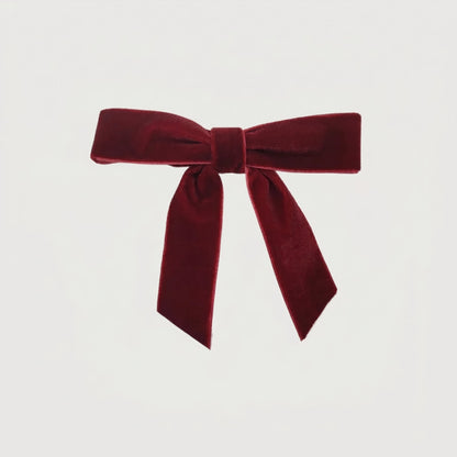 Burgundy velvet bow on white background