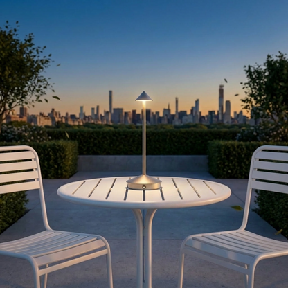 Remi indoor outdoor table lamp on outdoor dining table at sunset