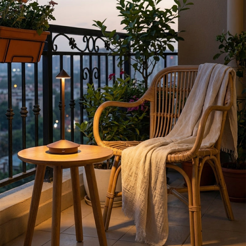 Remi indoor outdoor table lamp on balcony side table at dusk
