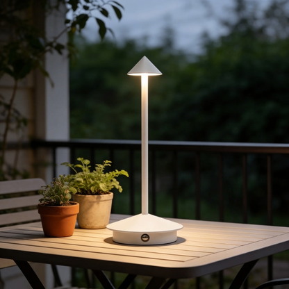 Remi indoor outdoor table lamp glowing outdoors at twilight