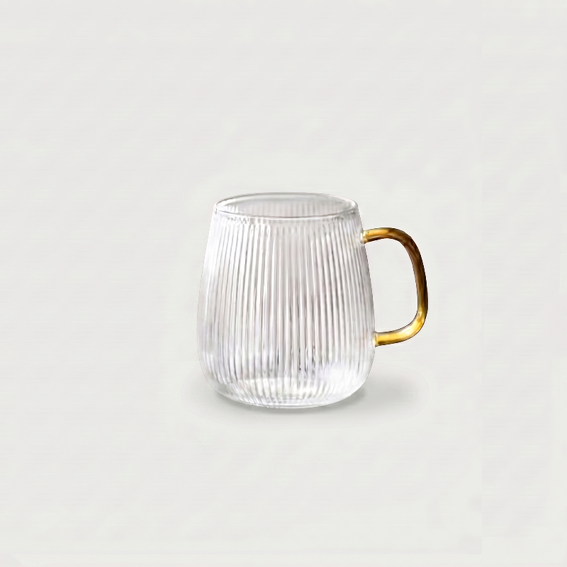 Ribbed glass mug on white background with clear handle