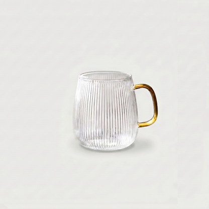Ribbed glass mug on white background with clear handle