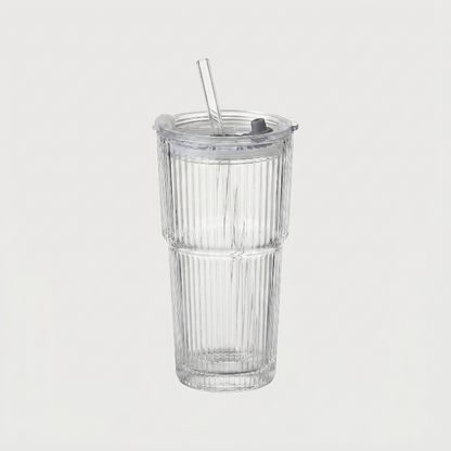 Ribbed glass tumbler on white background