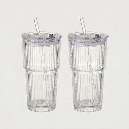 Set of two ribbed glass tumblers on white background