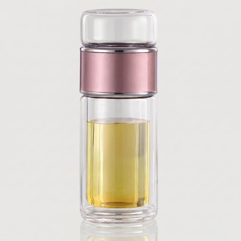Pink loose leaf tea infuser water bottle on white background