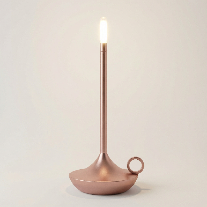 Candle holder with a lit candle on a plain background